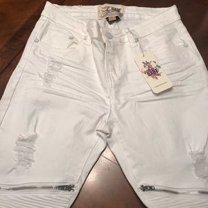 White jeans with rips and details